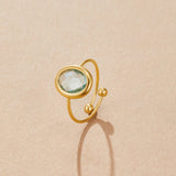 Golden ring with aquamarine crystal
