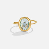Golden ring with aquamarine crystal