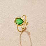 Anillo de oro con cristal de color esmeralda
