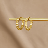 Pendientes de aro dorados de Leona